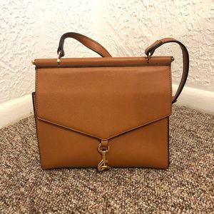 Light brown crossbody purse.